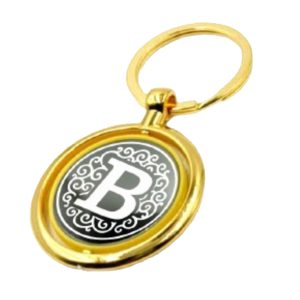 551 REVOLVING KEYRING METAL GLASS GOLDEN